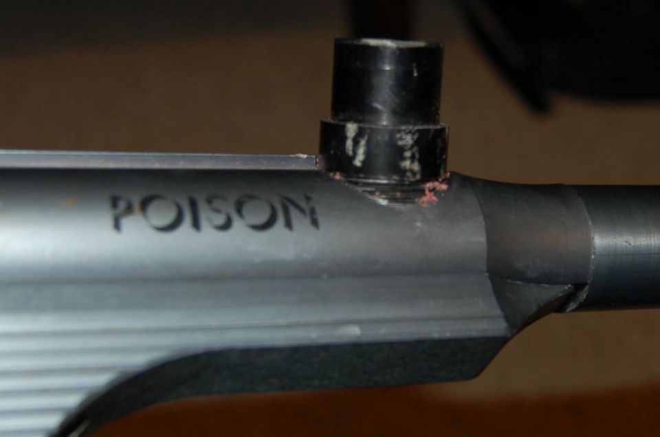 Part with "POISON" text engraved on it
