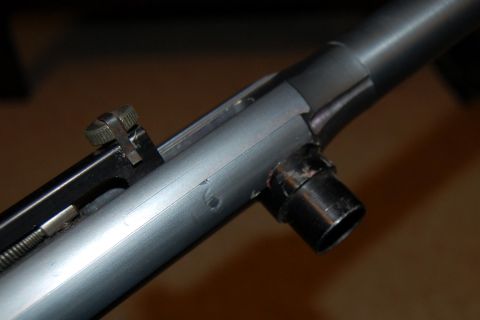 1994 Ford Bronco - Detail of a firearm's action, including the bolt and barrel connection.
