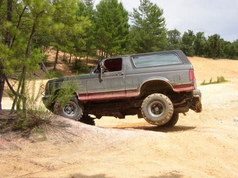 1991 Ford Bronco - This 1991 Ford Bronco is navigating challenging terrain off-road.