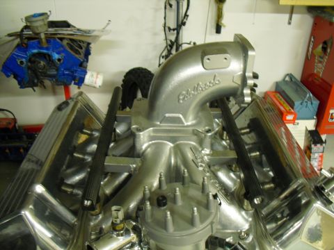 1996 Ford Bronco - Close-up of a V8 engine with polished chrome components and an Edelbrock intake.