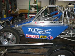1993 Ford Taurus - A custom-built race car is shown from the side, various sponsor decals and a driver's name.