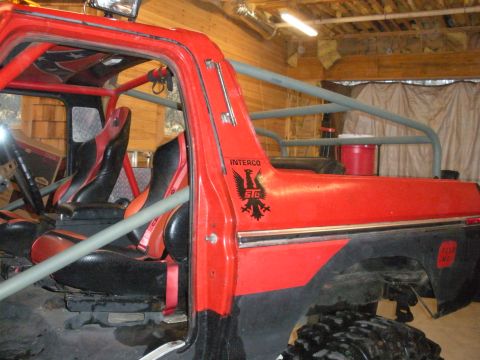 1979 Ford Bronco - Customized 1979 Ford Bronco interior features racing seats and a full roll cage.