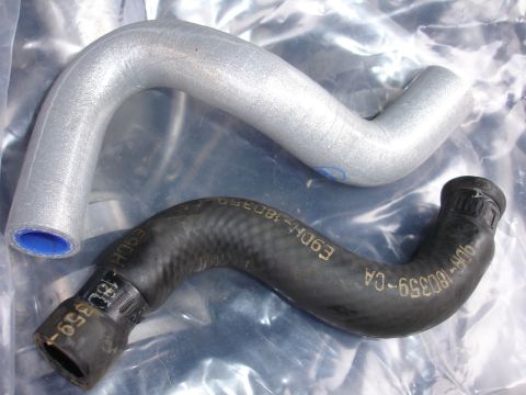 1993 Ford Taurus - Two radiator hoses are shown, one silver and one black, with part numbers visible on the black hose.