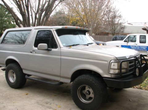 1992 Ford Bronco - This 1992 Ford Bronco is shown from a 3/4 front angle, a prominent bull bar on the front bumper.