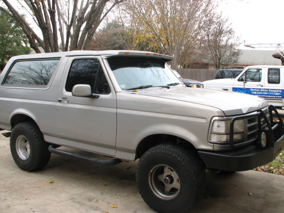 Silver 1992 Ford Bronco 3/4 front view with bull bar