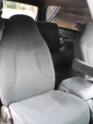 1992 Ford Bronco - Interior view of a vehicle, showing the front seats and center console. A watermark is present in the lower right corner.