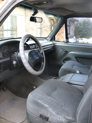 1992 Ford Bronco - Interior view of a 1992 Ford Bronco, highlighting the dashboard and seating.
