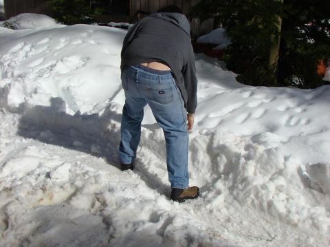 1989 Ford Bronco - A person is digging in a large pile of snow.