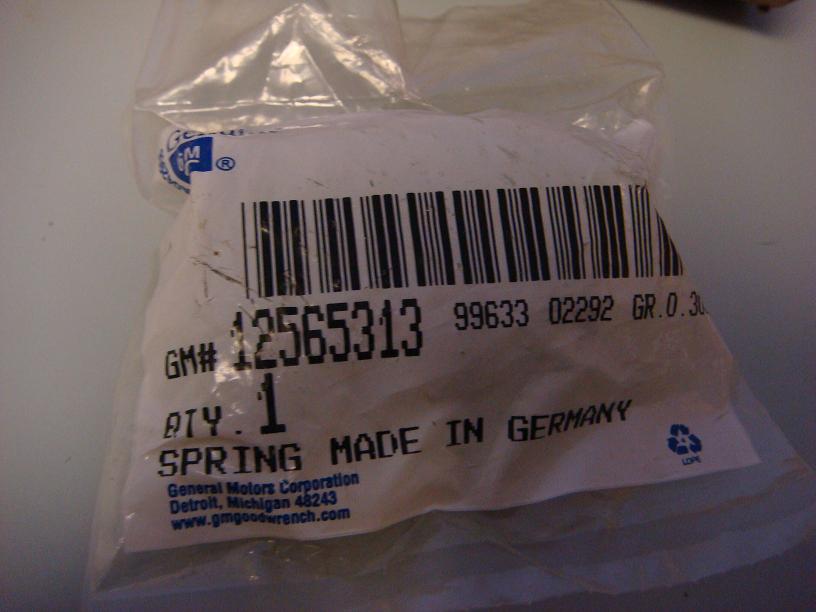 Sealed GM Goodwrench parts bag labeled GM# 12565313, spring made in Germany
