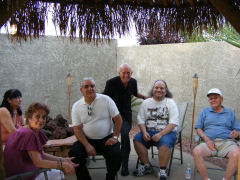 2008 Jeep Cherokee - A group of people are seated in chairs on a patio area.