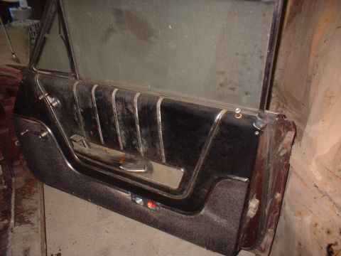 1963 Ford Galaxie - Interior door panel from a vintage car, showing upholstery and trim details.