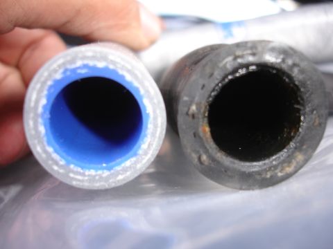 1992 Ford Taurus - Comparing a new silicone hose with a used rubber hose.