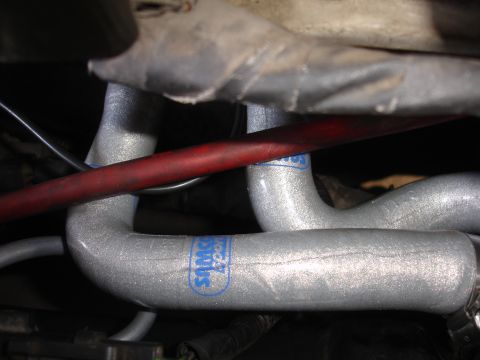 1992 Ford Taurus - Close-up view of silver engine hoses marked with the "Samco Sport" logo.