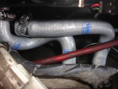 1992 Ford Taurus - Samco engine hoses with blue lettering and metal clamps are visible in this close-up view.