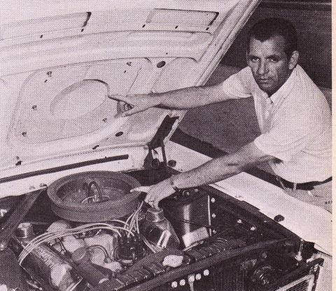 1968 Ford Mustang - A man inspects the engine compartment of a 1968 Ford Mustang, highlighting specific areas.