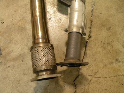 1998 Subaru Legacy - Comparison of an exhaust pipe with a flex joint and a catalytic converter flange.