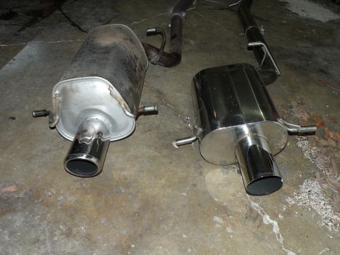 1998 Subaru Legacy - A comparison of a new, polished exhaust muffler next to an older, used one.