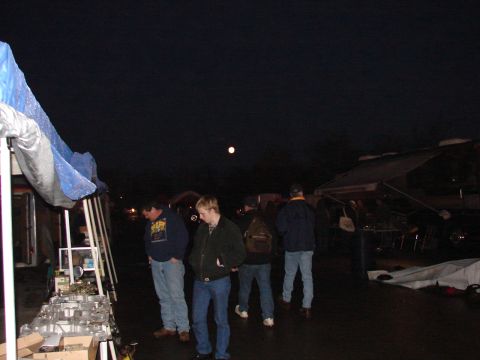 1973 Ford Ranchero - Several people browse items at an outdoor market under the moonlight.