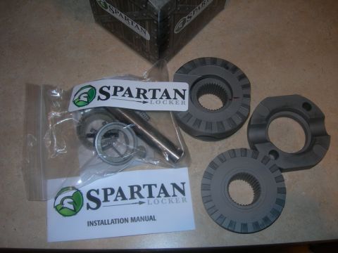 1991 Jeep Wrangler - Spartan Locker differential parts and installation manual shown on a table.