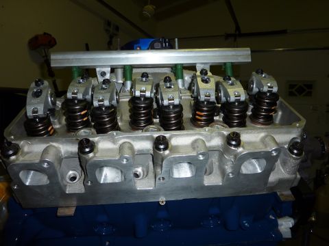 1971 Ford Mustang - Close-up of an engine cylinder head assembly, showing rocker arms, valve springs, and fuel injectors.