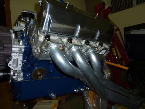 1971 Ford Mustang - Engine assembly chrome valve covers and silver exhaust headers, likely a performance upgrade.