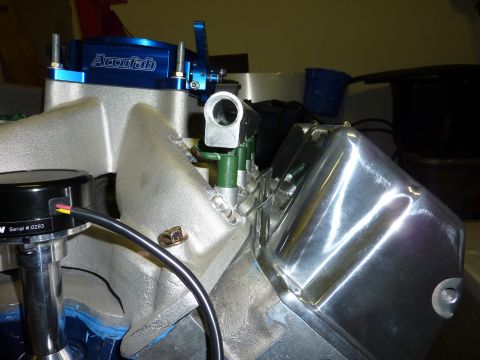 1971 Ford Mustang - Engine components including an intake manifold, carburetor, and distributor are shown in this close-up view.