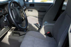 1996 Ford Bronco - The interior of a Jeep Cherokee is shown, focusing on the dashboard and seating area.