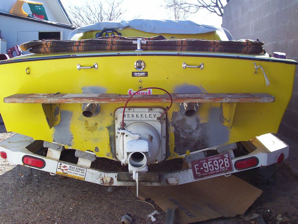 Rear of yellow jet boat on trailer with Berkeley jet drive and Arizona plate