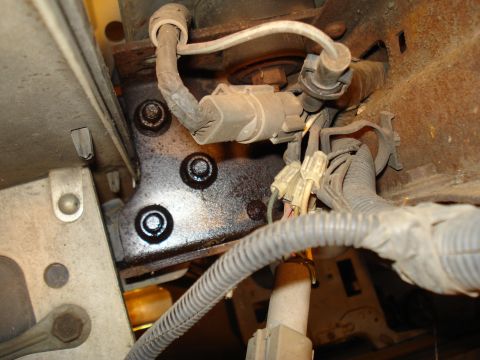 1991 Ford Bronco - Vehicle wiring harness and bracket detail, likely from the engine bay or undercarriage.