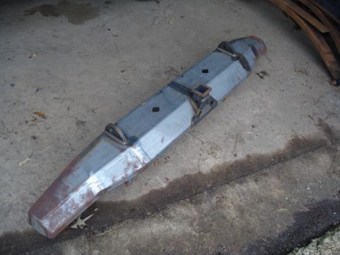 1991 Ford Bronco - A custom metal bumper, likely for an off-road vehicle, is shown on a concrete surface.