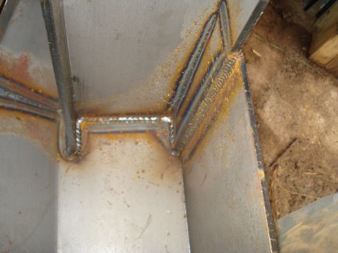 1991 Ford Bronco - Close-up view of welded metal components, showing signs of rust and discoloration.