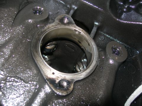1984 Ford Bronco - Close-up view of internal engine components, showing valve springs within a cylinder head.