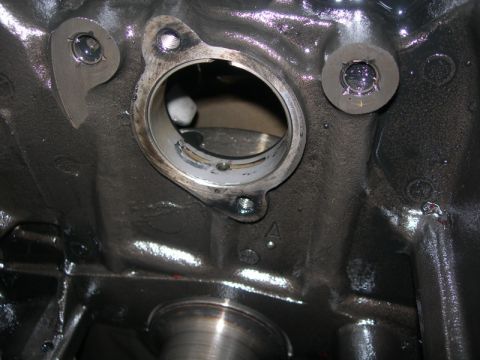 1984 Ford Bronco - Engine block detail showing a machined opening and bolt bosses.