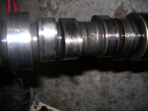 1984 Ford Bronco - This image shows a camshaft, a component of an internal combustion engine.