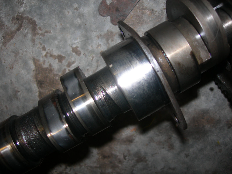 Camshaft with metal lobes and bearing surfaces, some wear visible