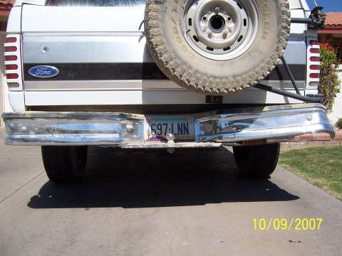 1996 Ford Bronco - Rear view of a 1996 Ford Bronco showing the bumper, spare tire, and license plate.
