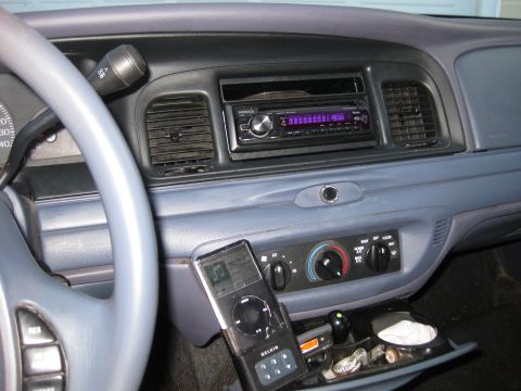 1999 Ford Crown Victoria - Interior view of a 1999 Ford Crown Victoria, an aftermarket Kenwood stereo and a Belkin device mount.