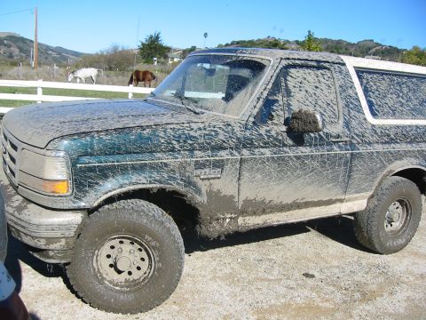1993 Ford Bronco - This 1993 Ford Bronco is heavily covered in mud after an off-road adventure.