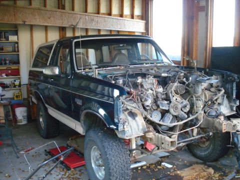 1993 Ford Bronco - This Ford Bronco is undergoing engine repair in a garage.
