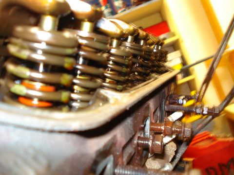 1993 Ford Bronco - A close-up view of the internal components of an engine, focusing on the valve springs and associated mechanical parts.