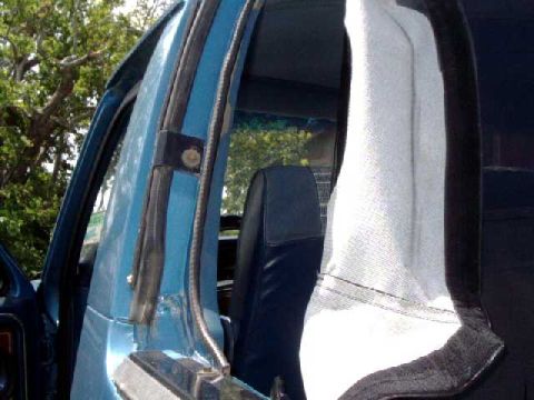 1984 Ford Bronco - side mounting bracket. The tab on the interior trim needs to be cut flat so it doesn't stick out (above the bolt)