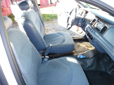 1997 Ford Crown Victoria - The interior of a 1997 Ford Crown Victoria shows front seats and dashboard details.