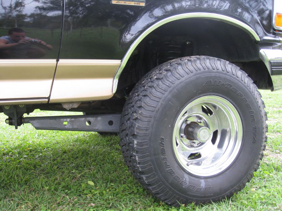 Side view of a 1994 Ford Bronco with a lift kit and 33-inch tires