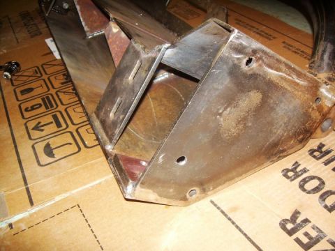 1995 Ford Bronco - Close-up view of a fabricated metal bracket, likely a custom automotive part.