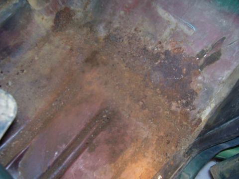 1979 Ford Bronco - Pass side floor. looks worse than it really is, just a few small holes and some loose rust.