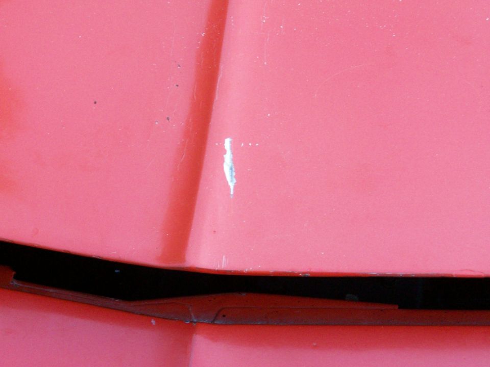 the front of the hood is full on bondo, and its starting to crack; we'll grind it all  off and fix the dent right.