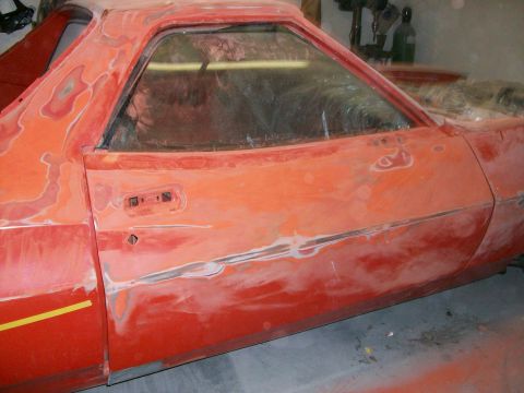 1973 Ford Ranchero - there is three coats of paint on the back half of the car, and four on the front half; it was red originally, then a loud orange and then t…