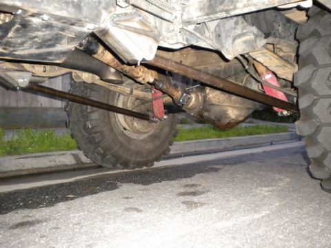 1989 Ford Bronco - Undercarriage details of a 4x4 vehicle, showing suspension and drivetrain components.
