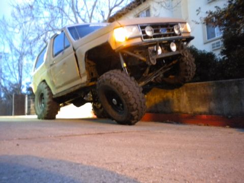 1989 Ford Bronco - This modified 1989 Ford Bronco features an aggressive stance with its lifted suspension and oversized off-road tires.