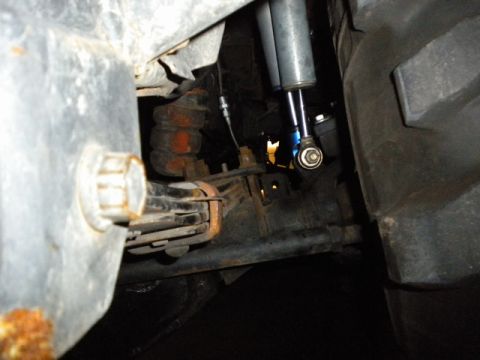 1989 Ford Bronco - Rear suspension components including leaf springs and shocks are visible in this close-up shot.